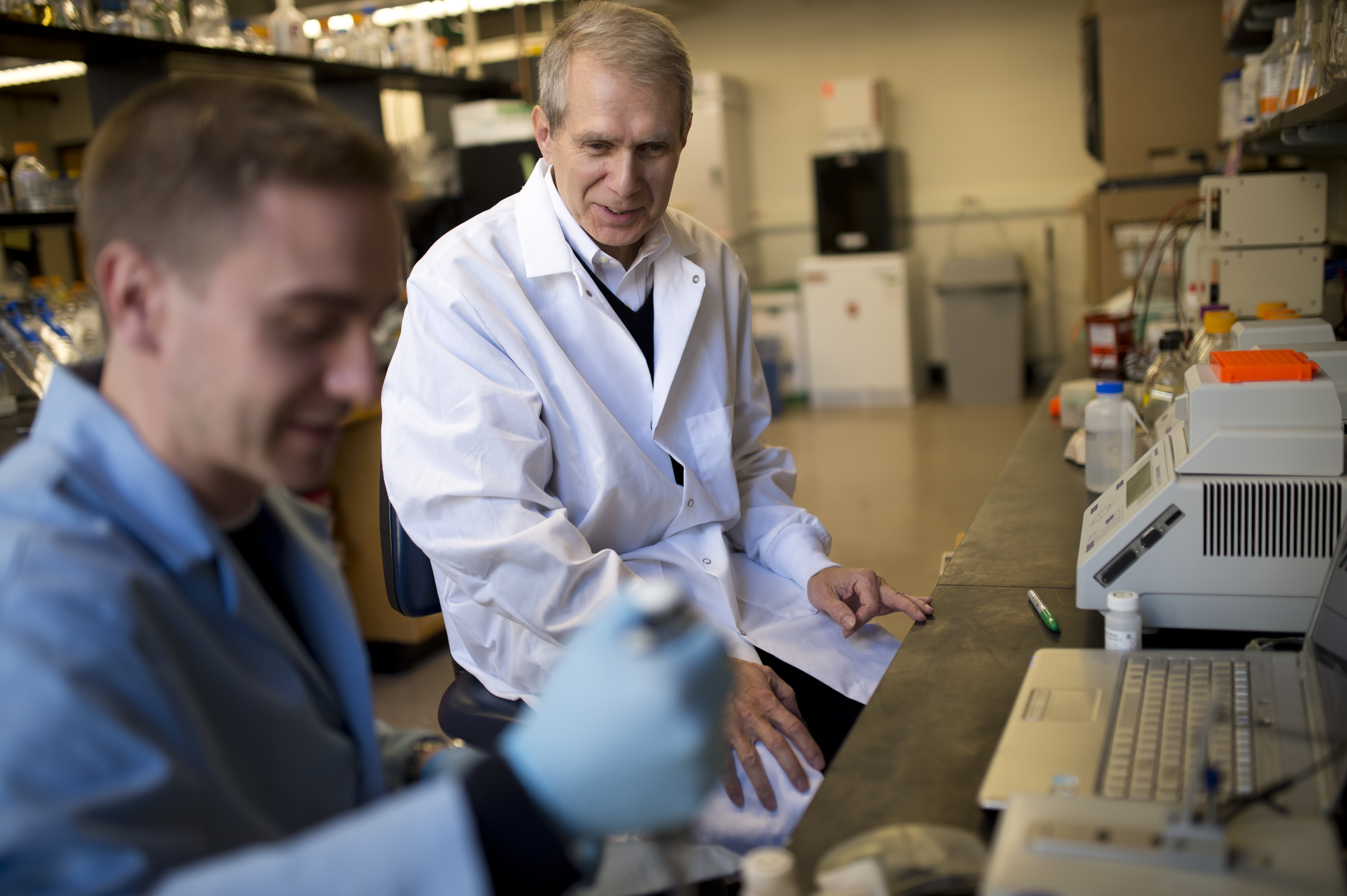 Kim Lewis, professor of biology, and post-doctoral researcher Brian Conlon work in Lewis' lab. 