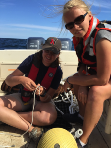 Patterson Lab Intern Katie Hudson (left) and her lab mate prepare one of Katie’s internal wave moorings for deployment in her study area off the coast of Rockport, MA