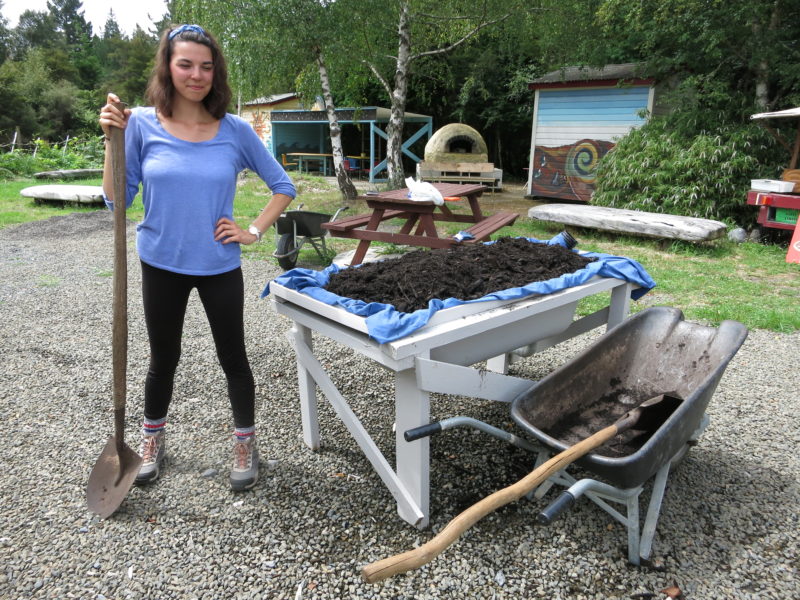 Amanda Kerr stands next to a wicking bed while on co-op at Awhi Farm in New Zealand.
