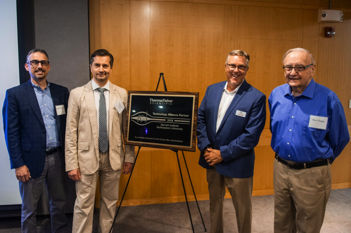 Drs. Pollastri, Ivanov, Carberry, and Karger (left to right) celebrating the Technology Alliance Partnership between Thermo Fisher Scientific and Northeastern University