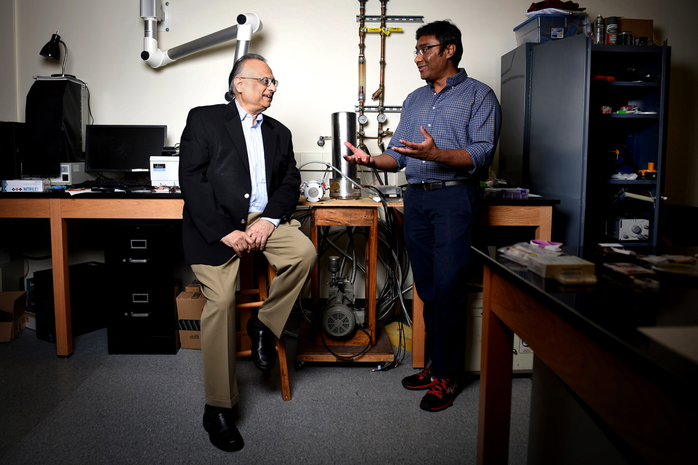 University Distinguished Professor of physics Arun Bansil (left) and associate professor of physics Swastik Kar accidentally discovered a new way to manipulate electronic charge. Photo by Matthew Modoono/Northeastern University