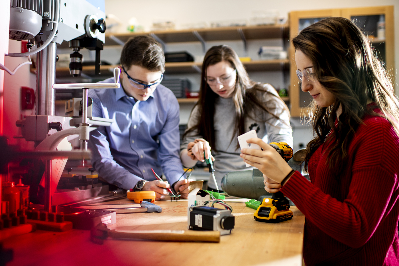 A team of Northeastern students was recently selected by NASA to enter the Big Idea Challenge, and will receive a $90,000 award to develop a robotic system to help astronauts explore permanently shadowed regions of the moon. From left: Julian Morgen, Paige Butler, and María Belén Ou. Photo by Ruby Wallau/Northeastern University