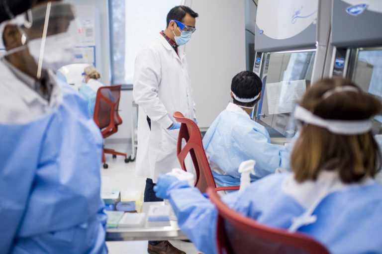 In the Trenches at Northeastern’s Coronavirus Testing Center by Day, Hitting the Books at Night