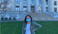 Emma Robinson poses for photo in front of Harvard Medical School.