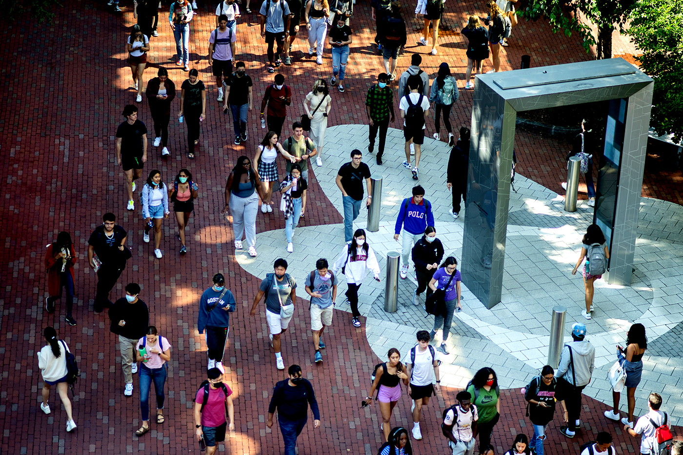 students walk through campus