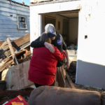 Angela Kirks and Thomas Kirks who lost their house are seen hugging after tornado hit Mayfield