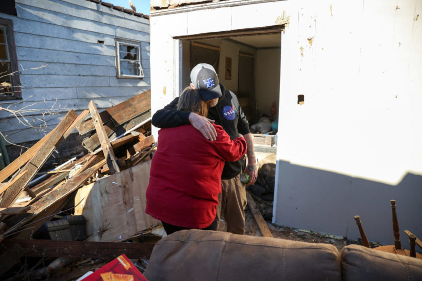 Angela Kirks and Thomas Kirks who lost their house are seen hugging after tornado hit Mayfield