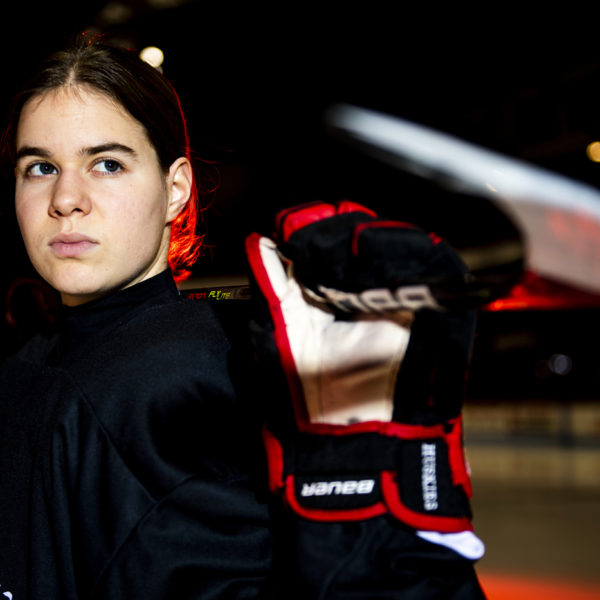 Alina Mueller poses in her hockey uniform