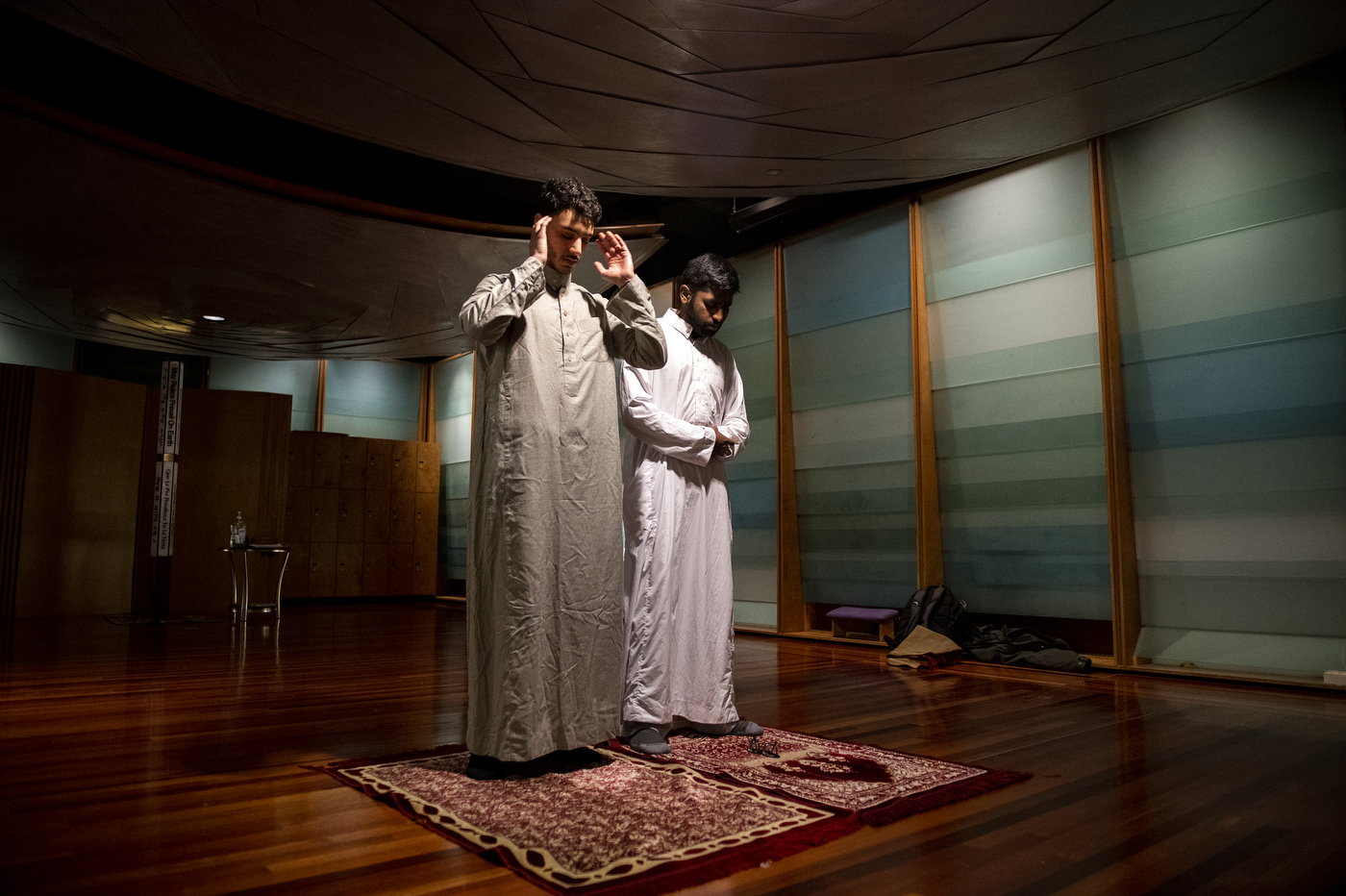 Northeastern students Omar Shoura and Shoyaib Shaik pray in the Sacred Space in Ell Hall