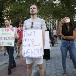 Activists gather at Foley Square in New York City with signs