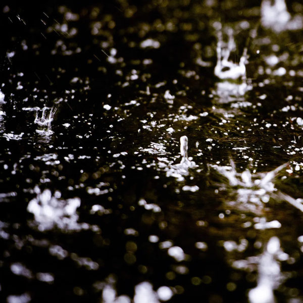 Splashing raindrops on water