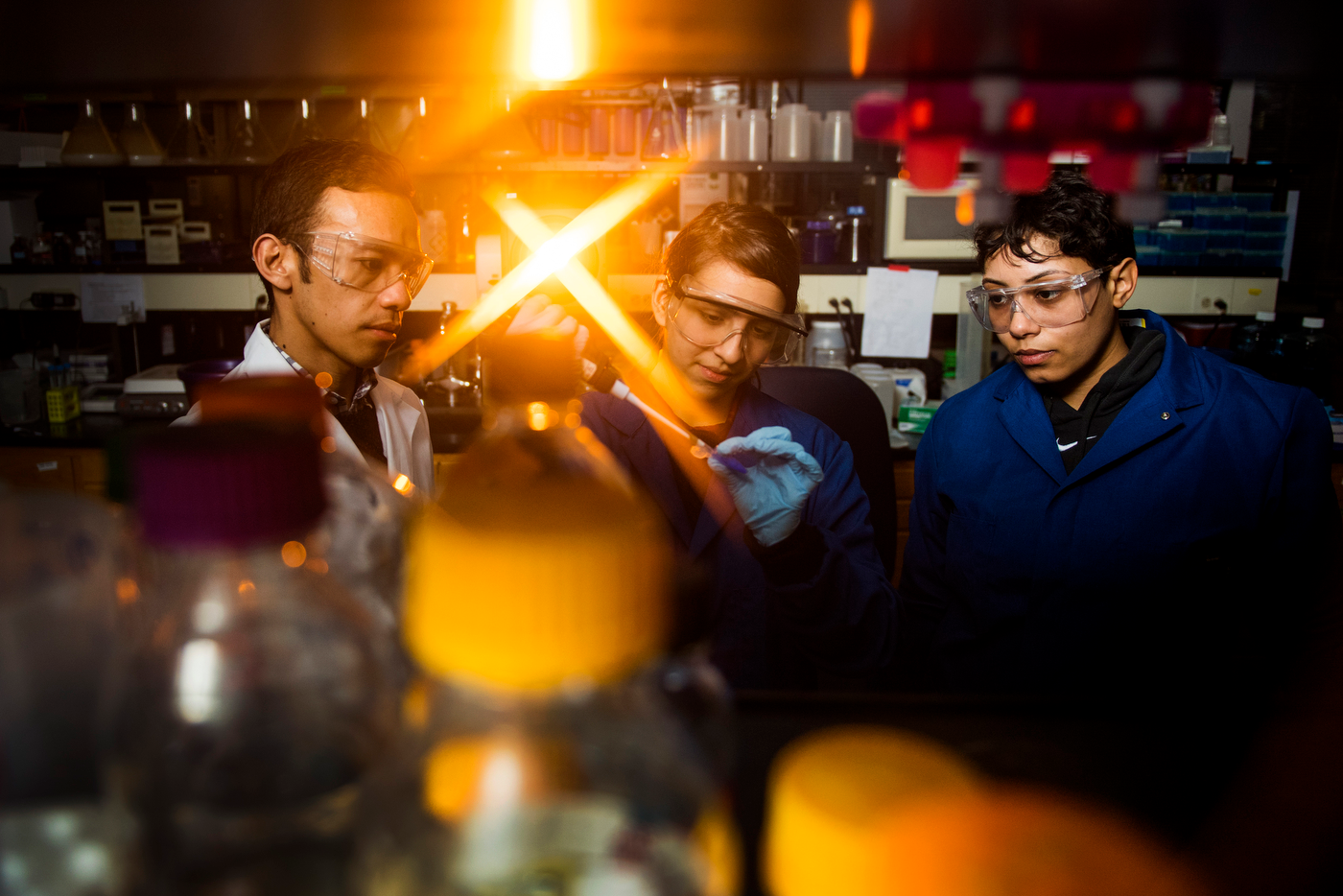 Three students working in the lab