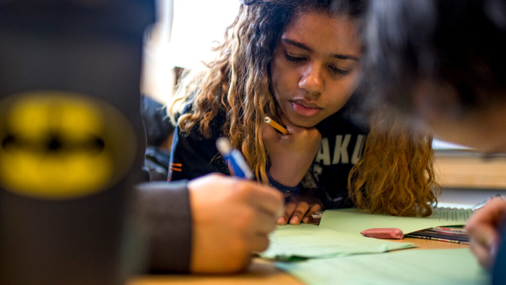 High school student working on a math problem