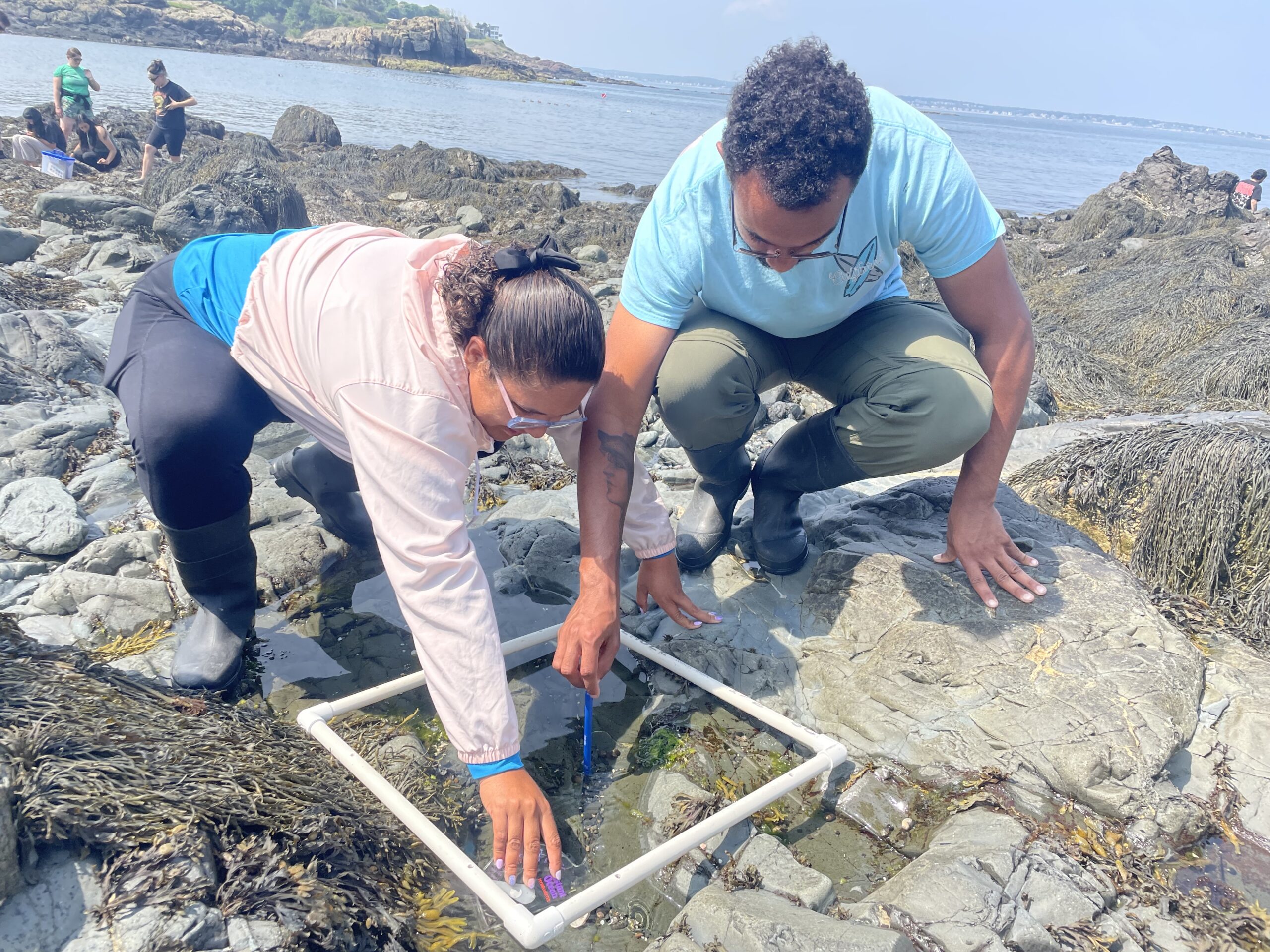 Two participants of the BEACHES program making ocean discoveries in Nahant, Massachusetts.