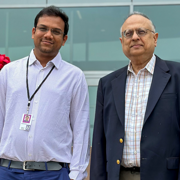 Physics professor Arun Bansil and postdoctoral research associate Barun Ghosh pose together.