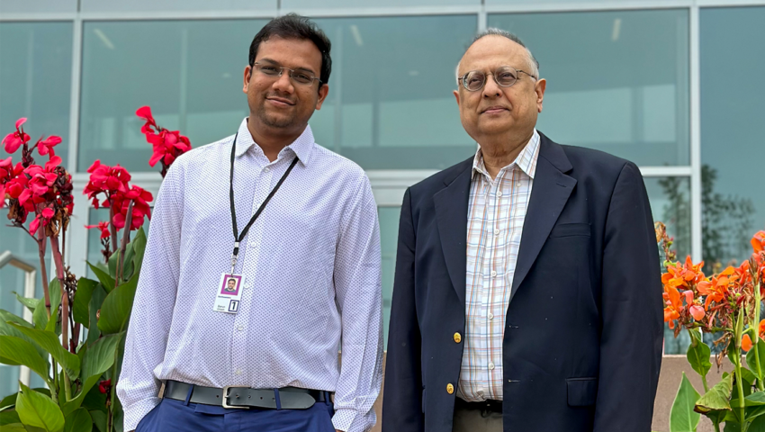 Physics professor Arun Bansil and postdoctoral research associate Barun Ghosh pose together.