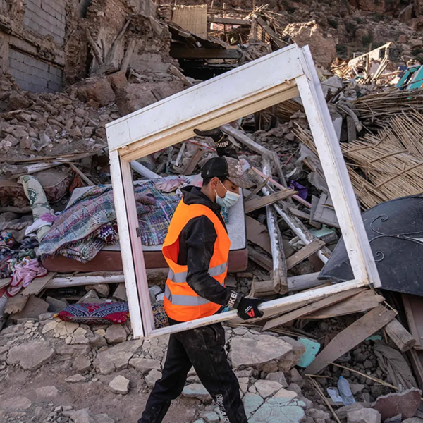 A volunteer helps salvage furniture from homes which were damaged by the earthquake, in the town of Imi N’tala, outside Marrakech, Morocco, Wednesday, Sept. 13, 2023.
