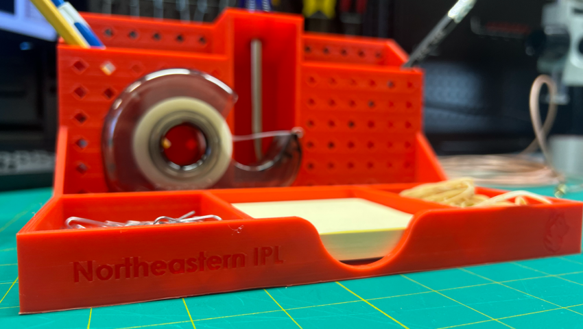 Northeastern inspired desk organizer that was 3D printed in the IPL Lab in Churchill Hall on Northeastern's Boston location.