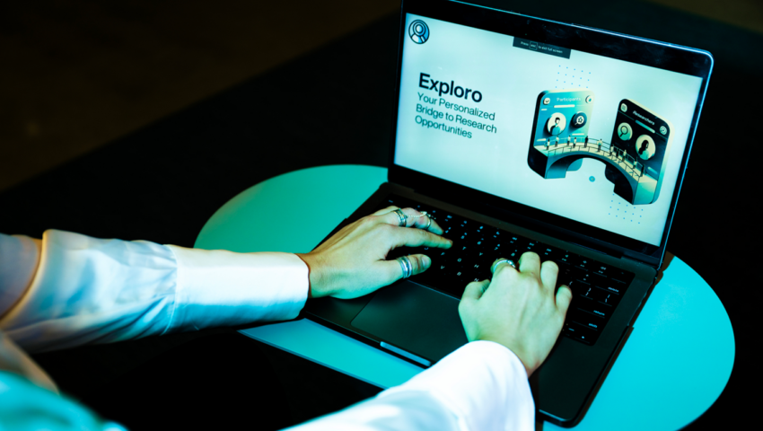 A person uses a computer that has a webpage open that is titled "Exploro".