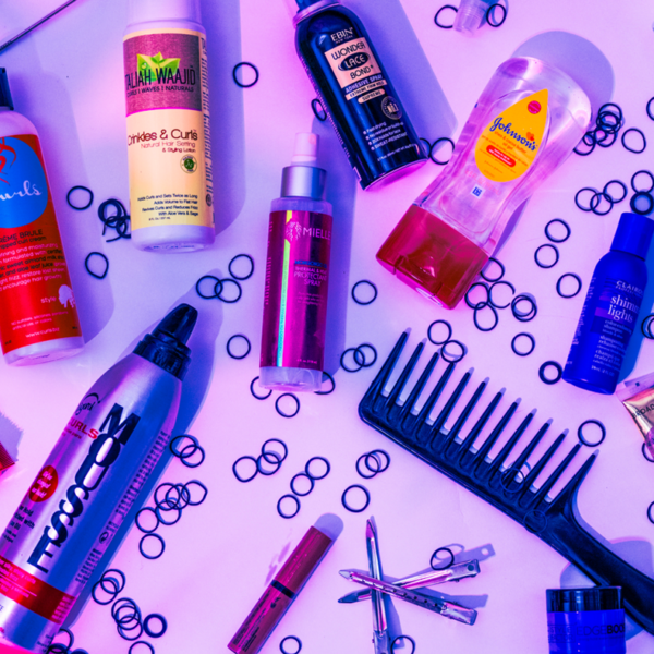 Various hair products on a purple background.