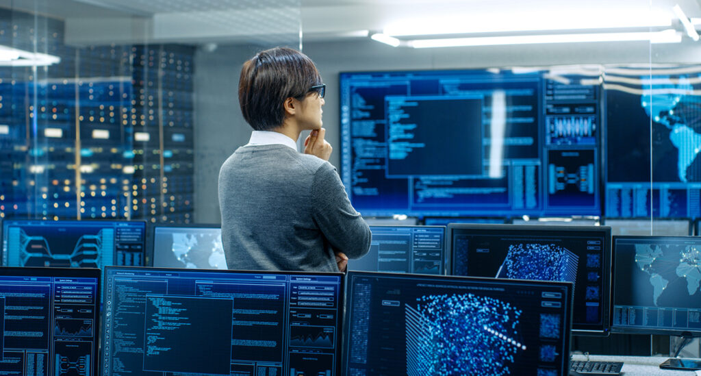 Data scientist standing in control room