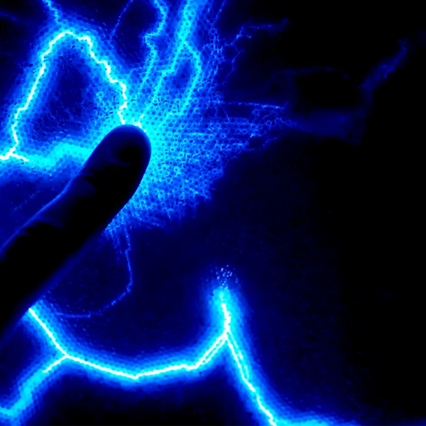 Black picture with blue electrical light in the shape of lighting.