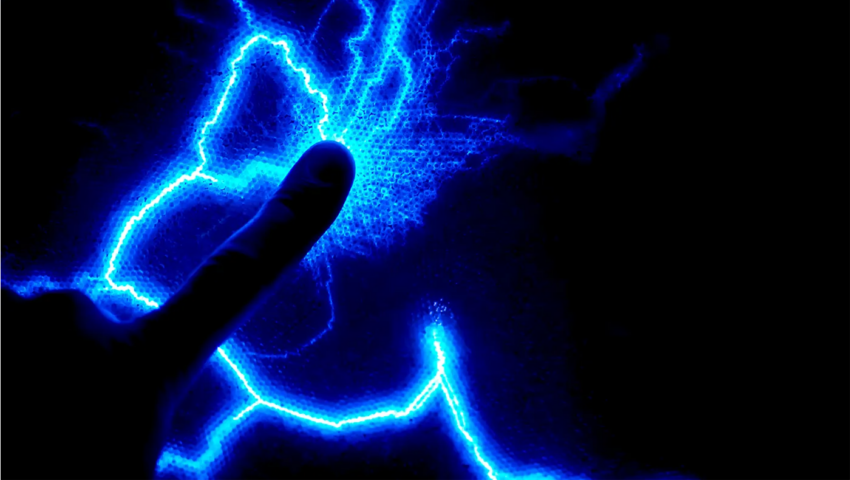 Black picture with blue electrical light in the shape of lighting.